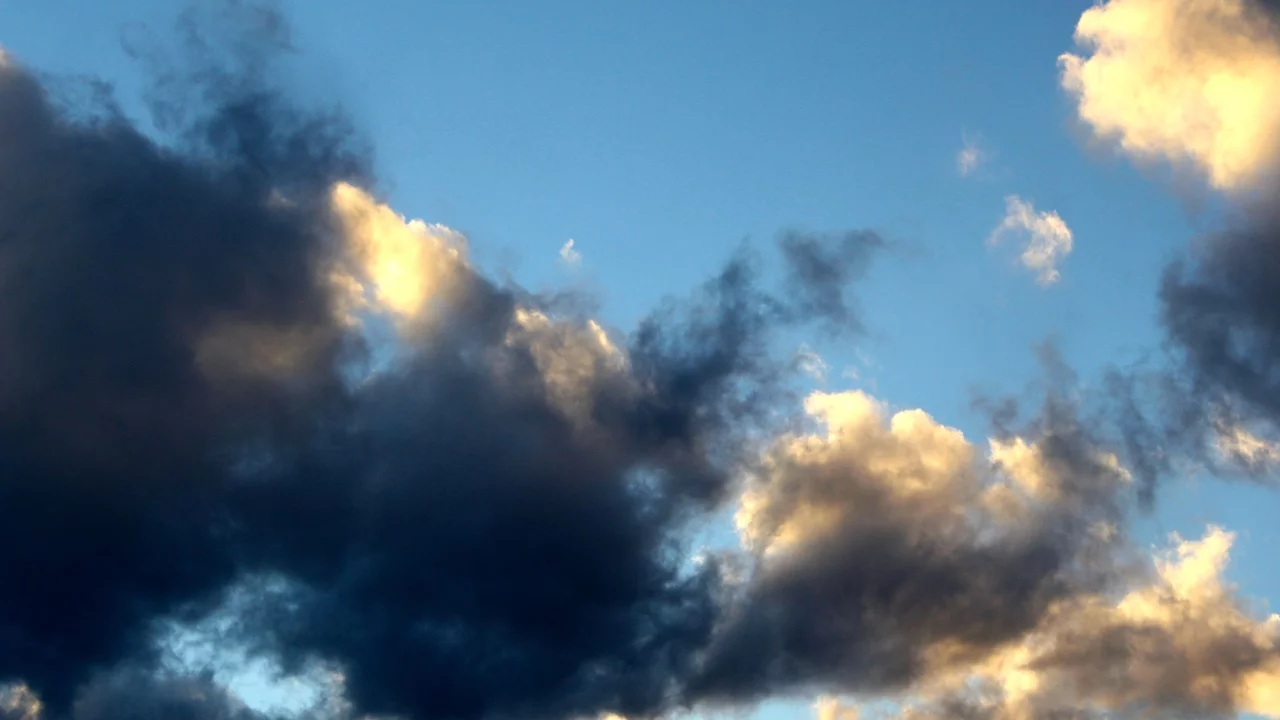 Depression and Low Mood Dark clouds obscuring the sun and lighter clouds - Depression and Low Mood