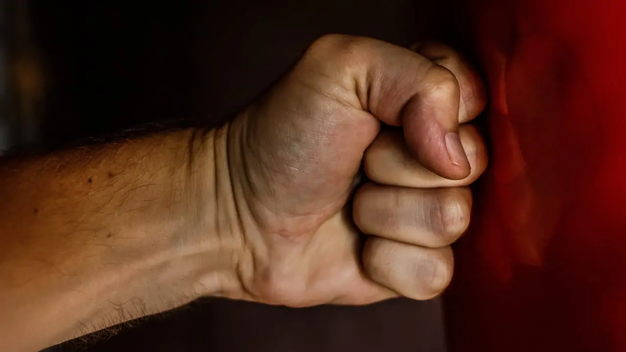 A human fist hitting a red punched - Coping Strategies