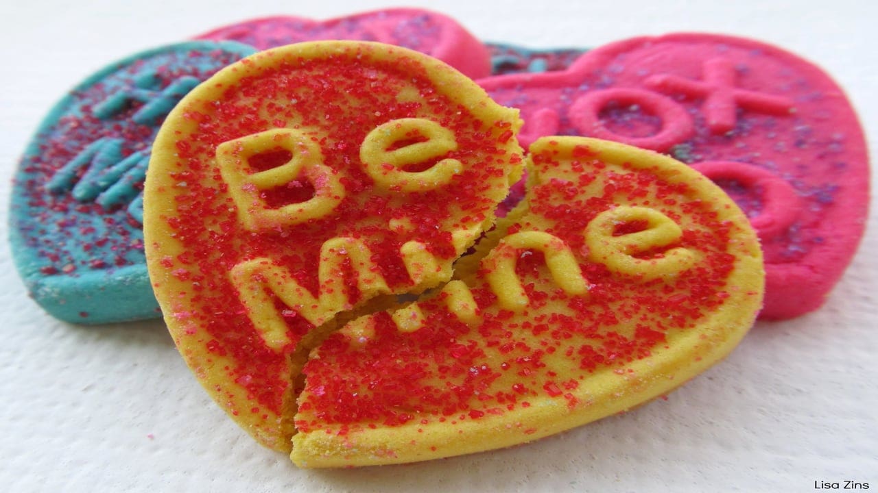 A broken love heart sweet which said 'Be Mine' - handing help when a relationship ends