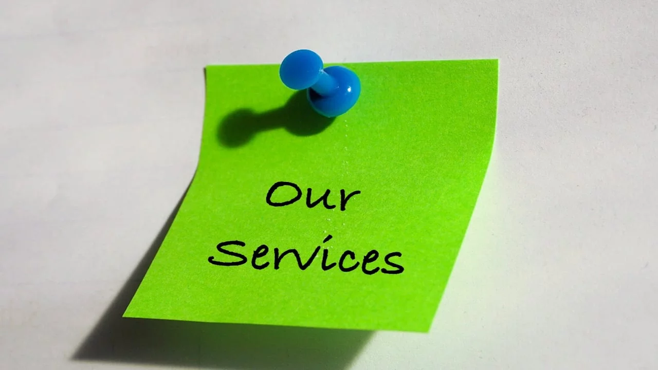 Our Services written on a green note pinned to a board